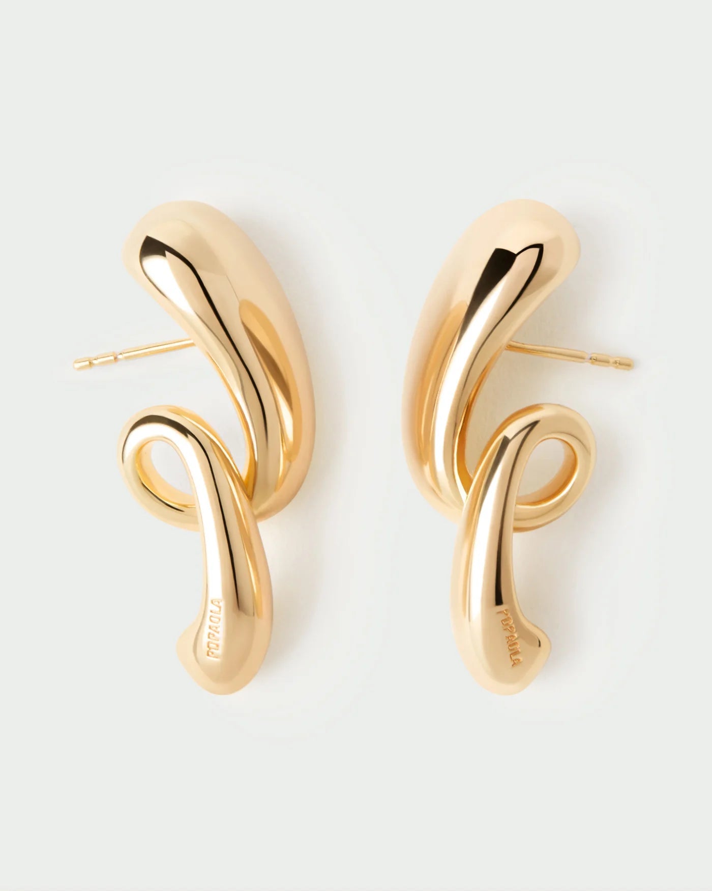 Pendientes Orbit — Plata de ley con baño de oro y diseño escultural en espiral — ROUCLÊ Maison Contemporaine