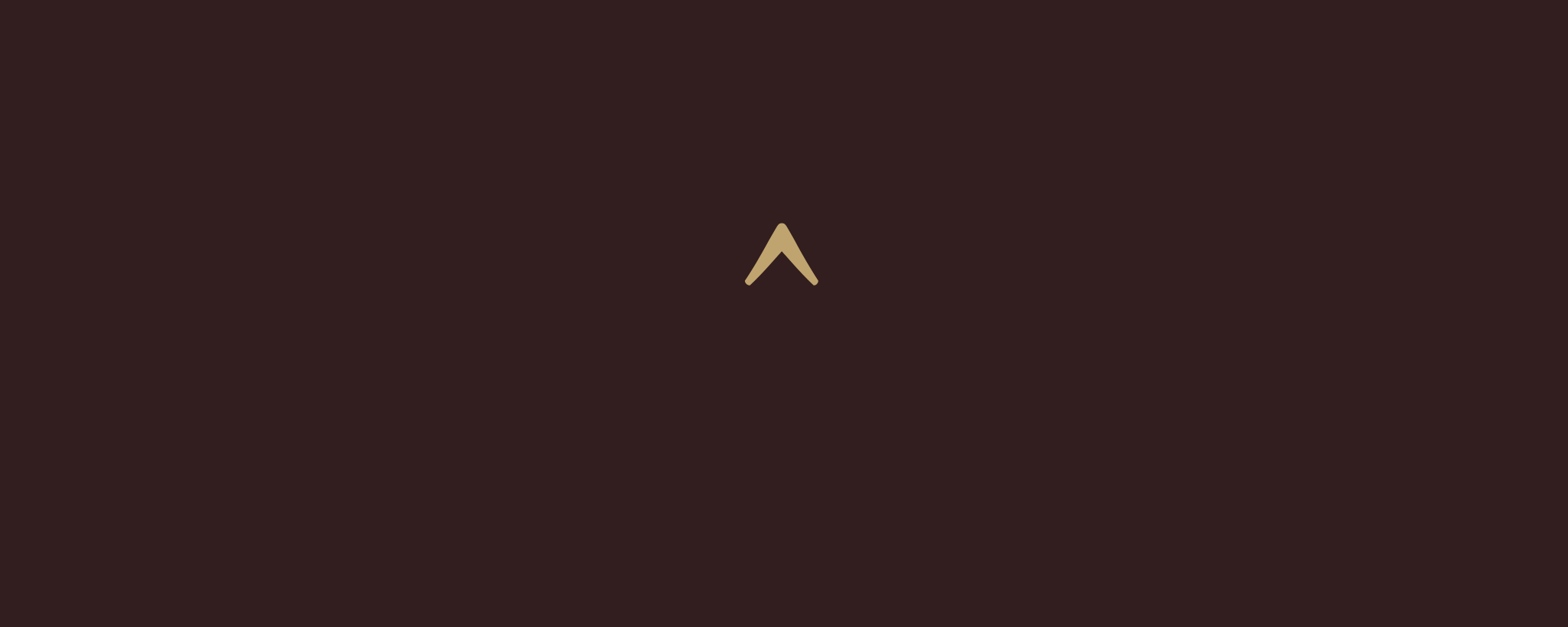 Minimalist gold symbol (^) centered on dark brown background — signature identity of ROUCLÊ Maison Contemporaine.